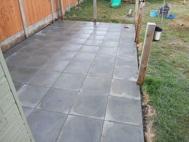 Grey patio with timber posts