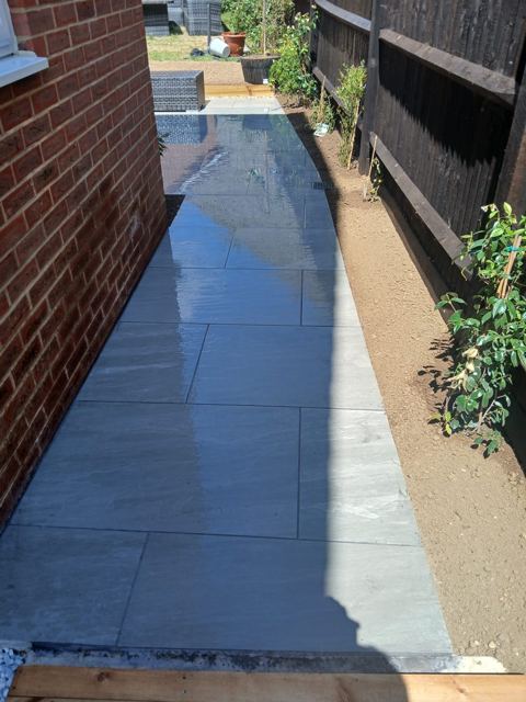 Grey paved side passage